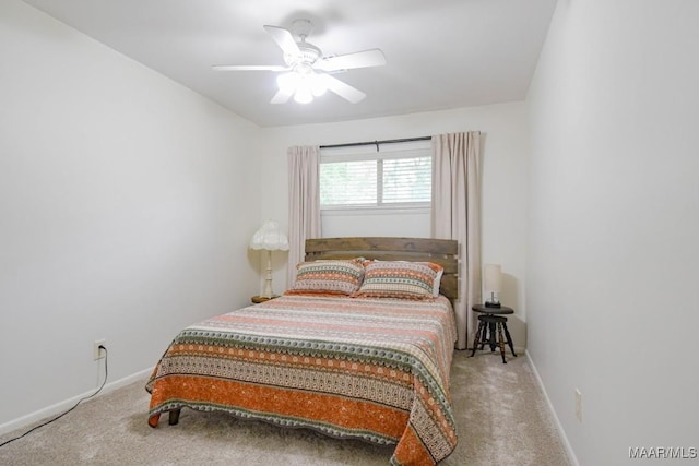 bedroom with baseboards, carpet, and a ceiling fan