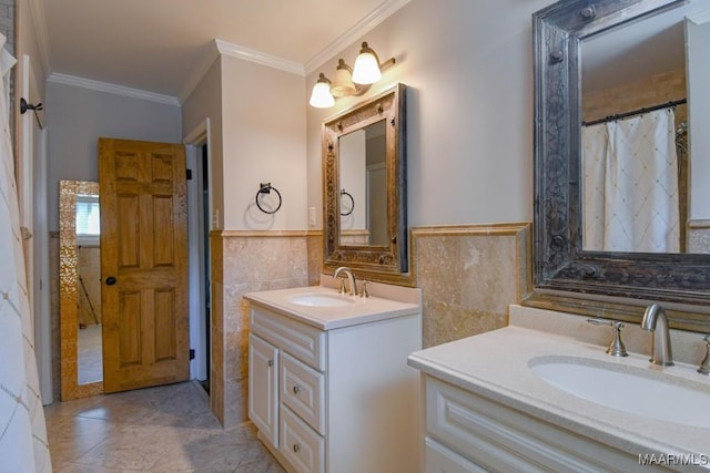 full bathroom with a sink, two vanities, tile walls, and ornamental molding