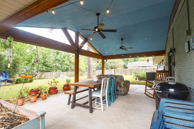 view of patio with outdoor dining area, area for grilling, a fenced backyard, and a ceiling fan