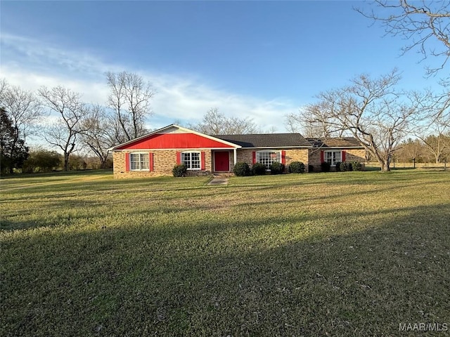 ranch-style home featuring a front yard