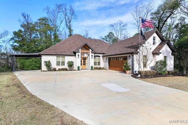 view of front of home with a carport, a garage, and a front yard