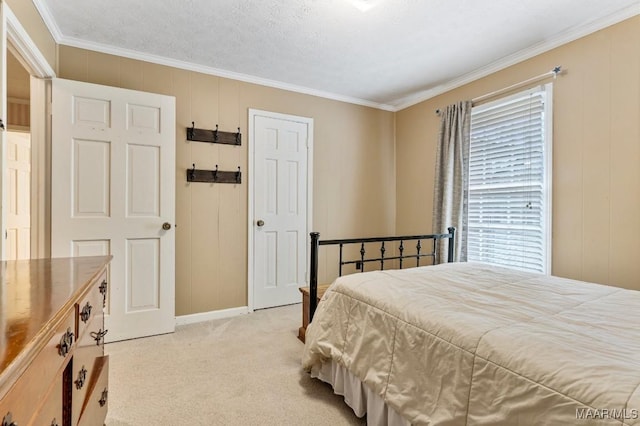 bedroom with crown molding and light colored carpet