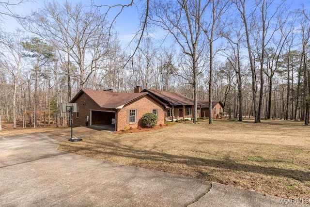 view of property exterior with a garage and a lawn