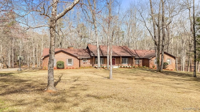 ranch-style home with a front lawn