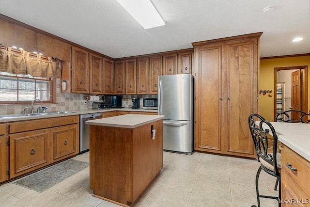 kitchen with light tile patterned flooring, a kitchen island, tasteful backsplash, sink, and stainless steel appliances