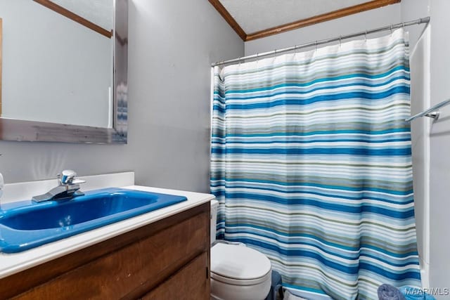 bathroom featuring vanity, toilet, crown molding, a textured ceiling, and a shower with shower curtain