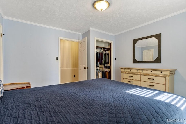 bedroom with crown molding, a closet, and a textured ceiling