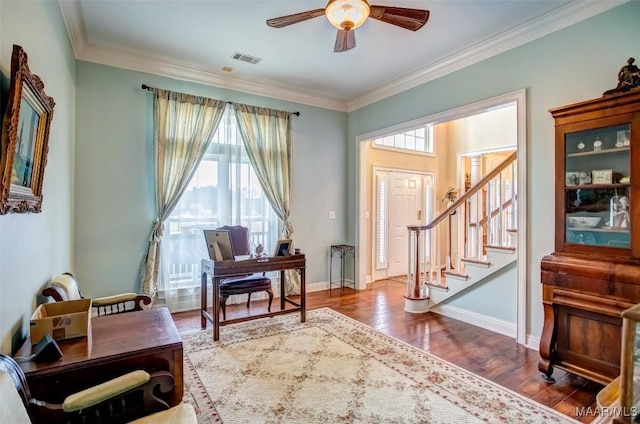 sitting room featuring hardwood / wood-style flooring, ornamental molding, and ceiling fan