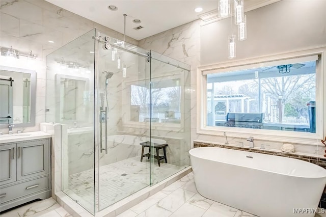 bathroom featuring vanity, shower with separate bathtub, and tile walls