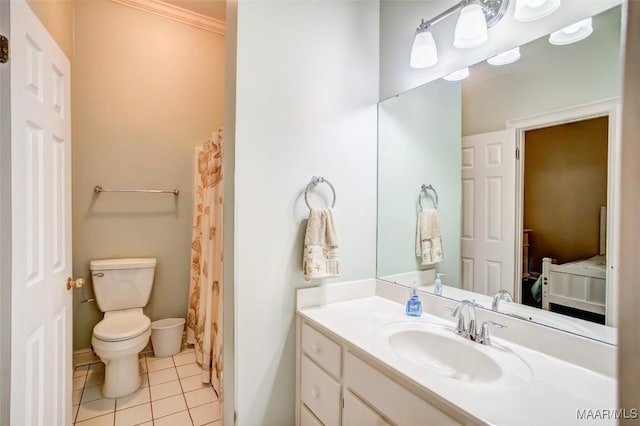 bathroom with vanity, tile patterned floors, and toilet