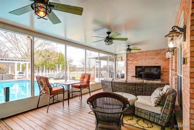 sunroom / solarium featuring a healthy amount of sunlight