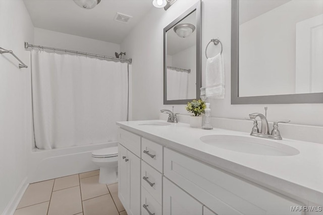 full bathroom featuring tile patterned flooring, vanity, shower / tub combo with curtain, and toilet