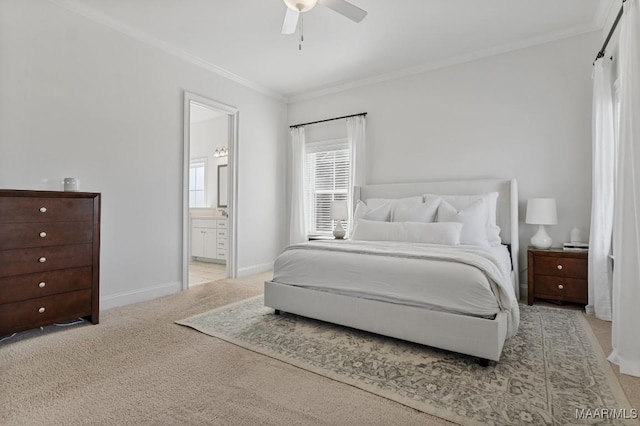 carpeted bedroom with ornamental molding, ceiling fan, and ensuite bath