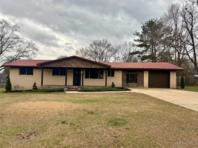 ranch-style home with a garage and a front yard