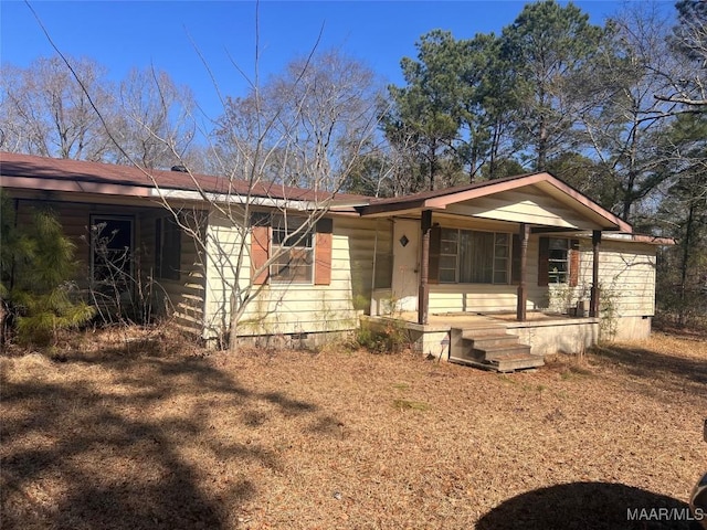 ranch-style house with covered porch