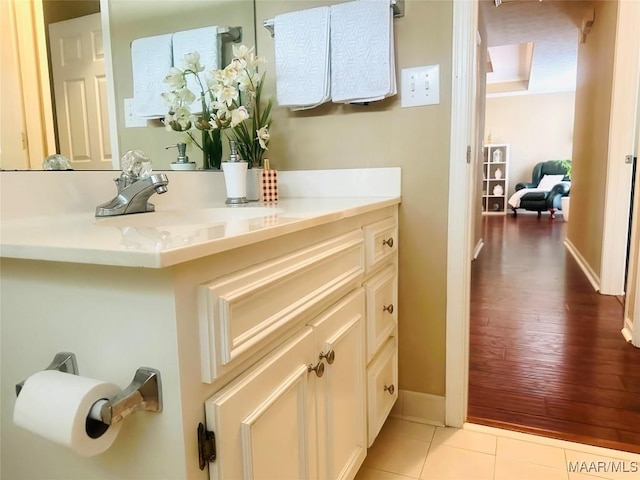 bathroom with tile patterned floors and vanity