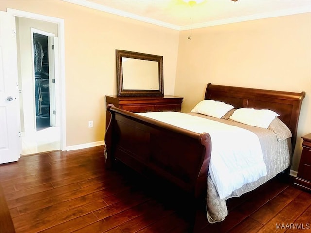 bedroom featuring dark hardwood / wood-style flooring and crown molding