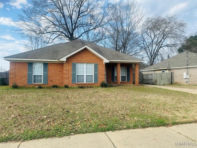 ranch-style home featuring a front yard