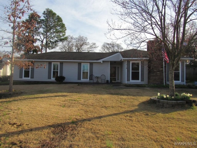 ranch-style house with a front lawn