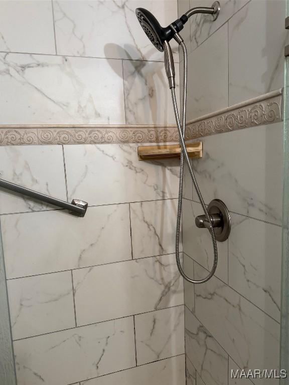 details featuring a tile shower