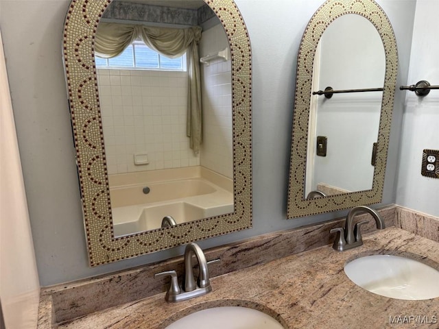 bathroom with a sink and double vanity