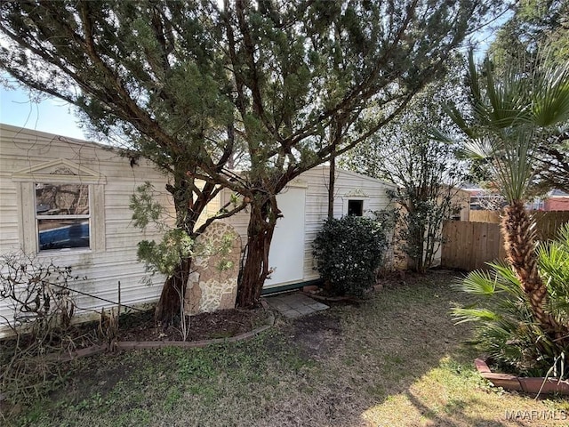 view of home's exterior with fence