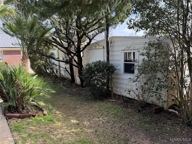 view of property exterior with brick siding