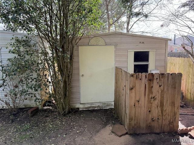 view of shed with fence