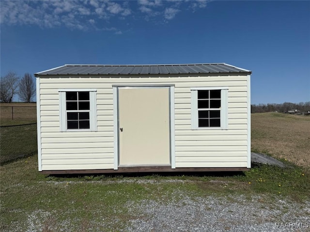 view of outdoor structure with a yard