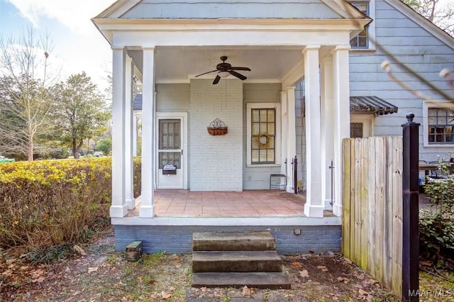 property entrance featuring ceiling fan and a porch