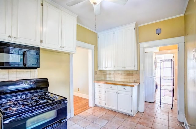 kitchen featuring tasteful backsplash, white cabinetry, crown molding, and black appliances