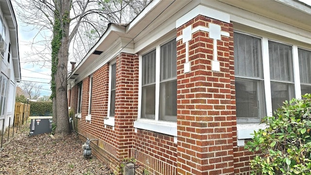 view of side of home featuring central AC