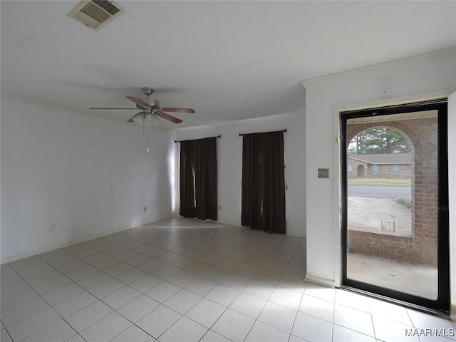 tiled spare room with crown molding and ceiling fan