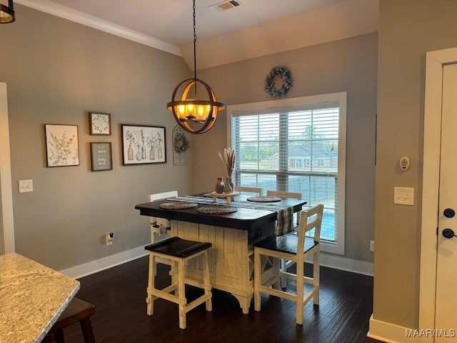 dining room with ornamental molding and dark wood-type flooring