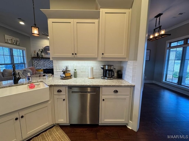 kitchen featuring crown molding, white cabinetry, hanging light fixtures, light stone countertops, and stainless steel dishwasher