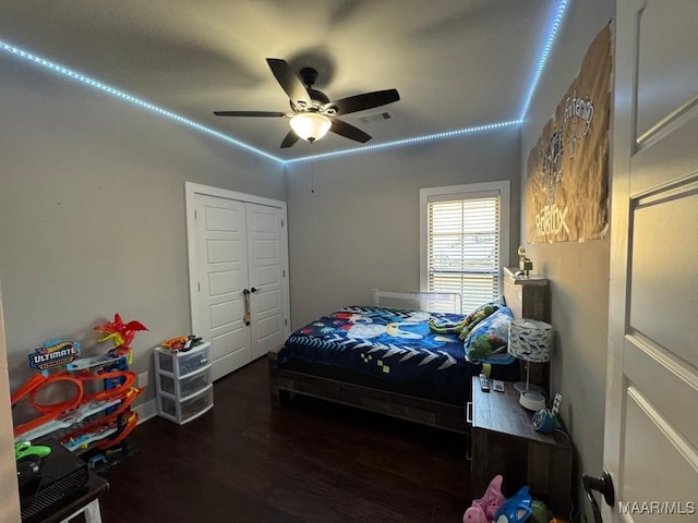 bedroom featuring ceiling fan and dark hardwood / wood-style flooring