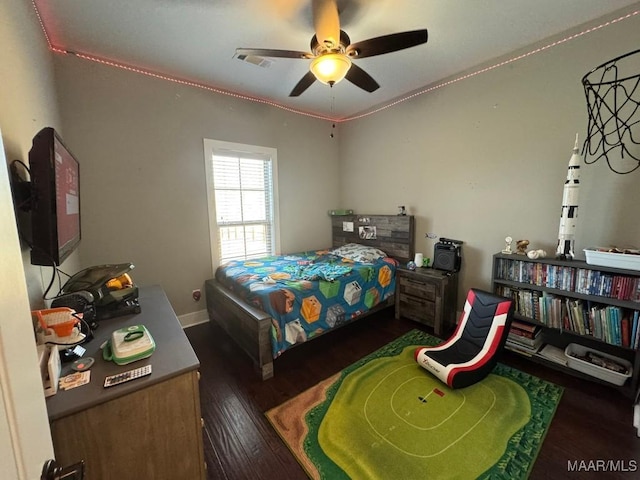 bedroom featuring ceiling fan and dark hardwood / wood-style flooring