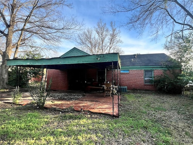 back of house with a carport