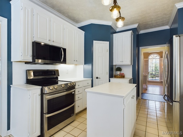 kitchen featuring stainless steel appliances, white cabinetry, a kitchen island, and light tile patterned flooring