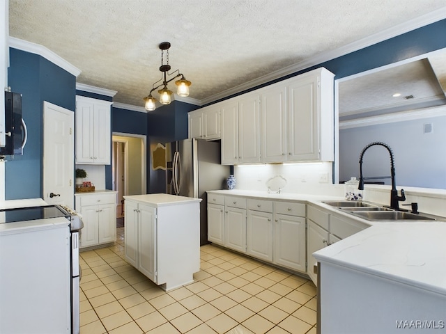 kitchen with sink, white cabinetry, hanging light fixtures, a center island, and ornamental molding