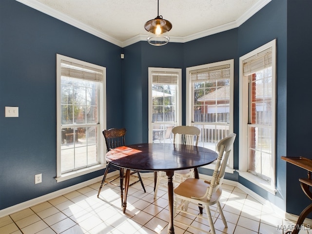 tiled dining area with crown molding and a textured ceiling