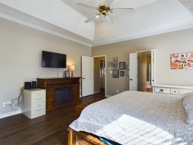 bedroom featuring dark hardwood / wood-style flooring, vaulted ceiling, ornamental molding, and ceiling fan