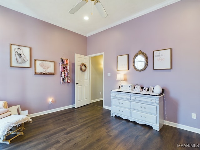 sitting room featuring ornamental molding, dark hardwood / wood-style floors, and ceiling fan