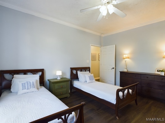 bedroom with crown molding, dark hardwood / wood-style floors, and ceiling fan