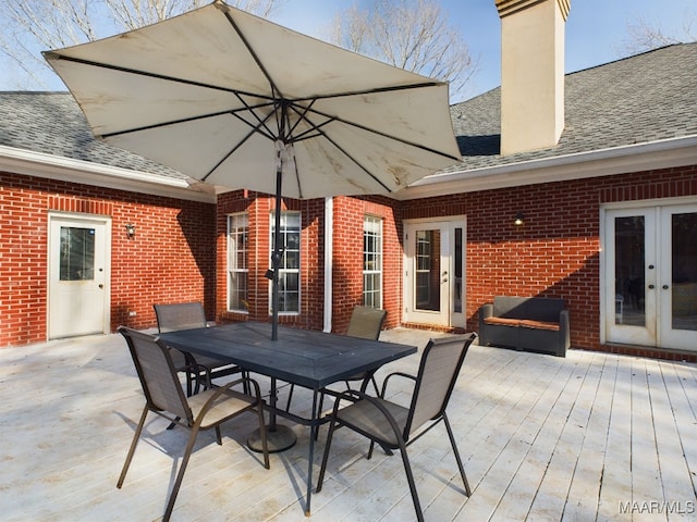 view of patio with french doors and a deck