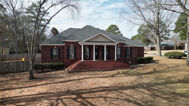 view of front of property with a porch and a front lawn