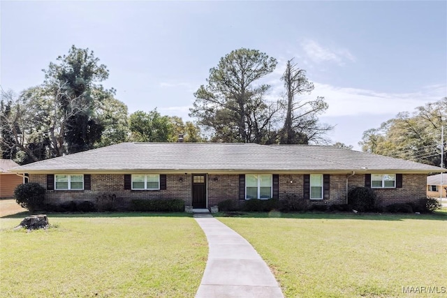 ranch-style home featuring a front yard