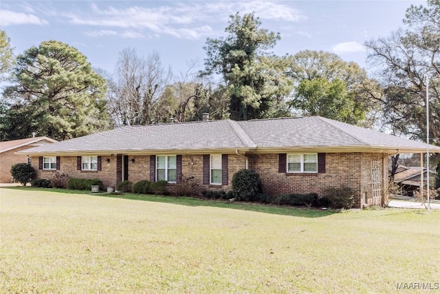 single story home featuring a front lawn