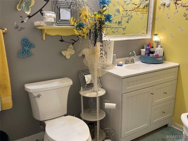 bathroom with vanity and toilet