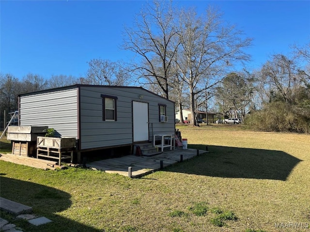 view of outdoor structure with a lawn